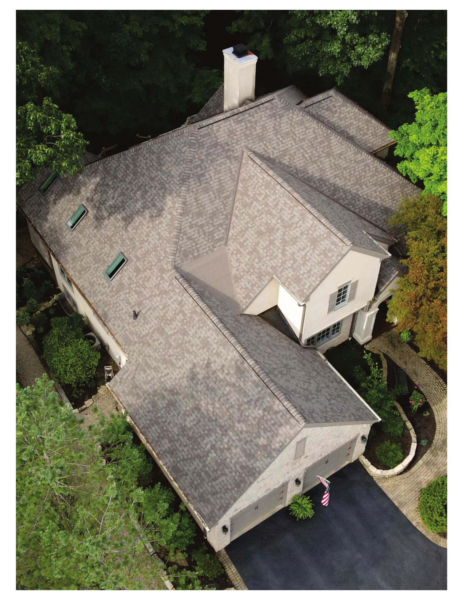 Aerial photo of a Central Ohio home with a freshly installed Newman Roofing shingle roof