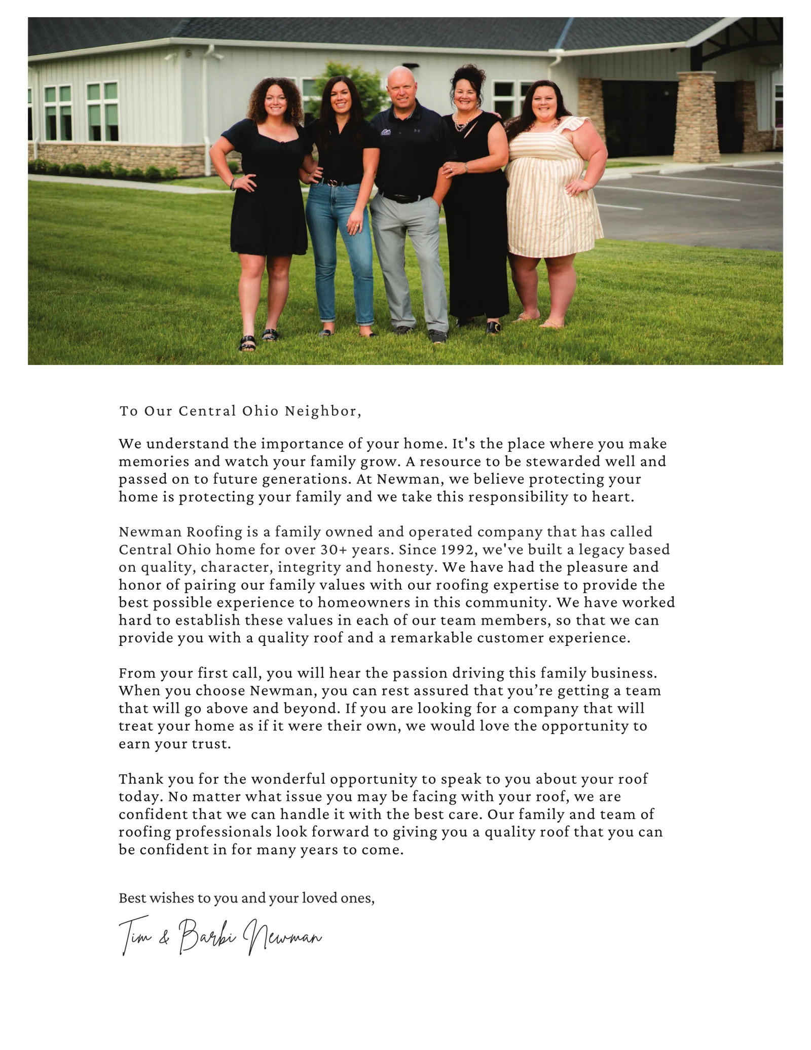 The Newman family — Tim, Barbi, and their team — on the lawn in front of the Newman Roofing office